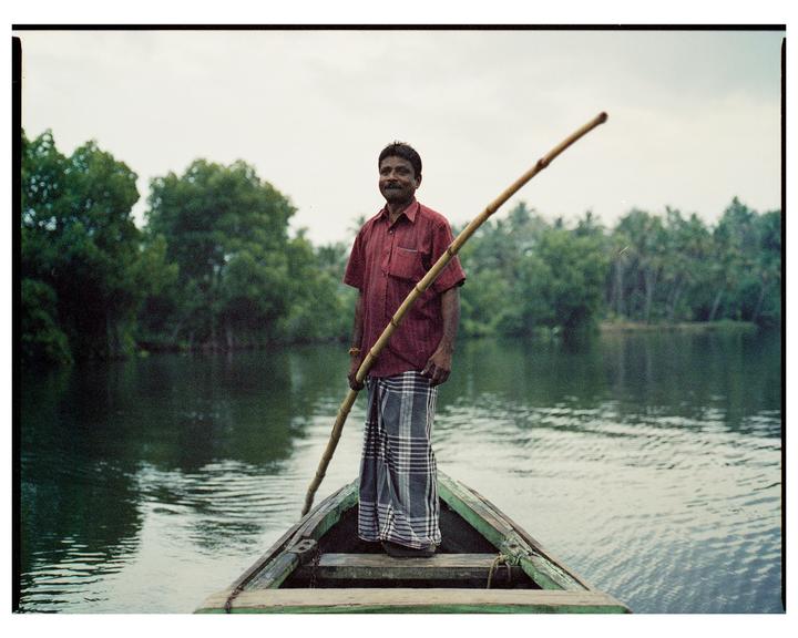 Portrait of fisherman in his boat. Kerala, India [Bronica ETRS, 75mm 2.8, Cinestill 800]