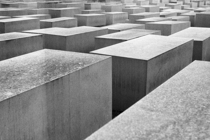 A field of concrete blocks of varying heights is shown from an elevated perspective.