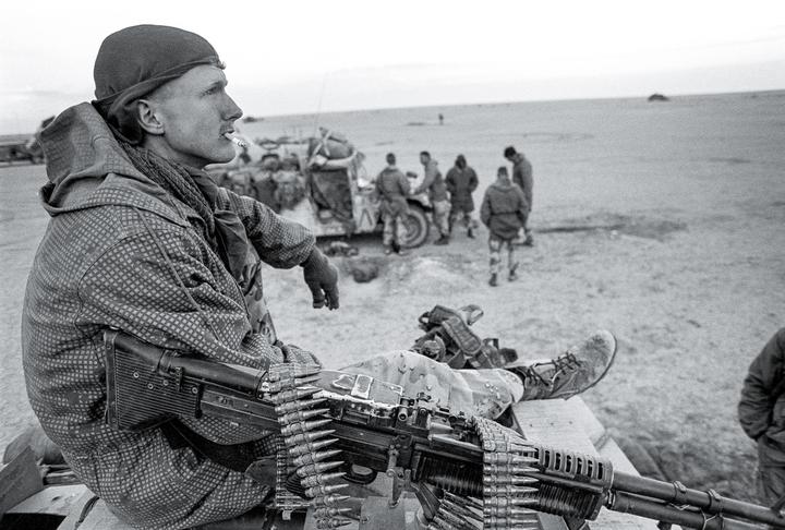 35th Anniversary of Desert Storm: Guys from my MI collection team just after the ceasefire notification was announced. The paratrooper in the foreground was awarded the Bronze Star for his actions during a nighttime firefight. Near AsSalman Iraq. Feb 28, 1991. [Nikon FA, 35mm f/2 on Tri-X 400.]