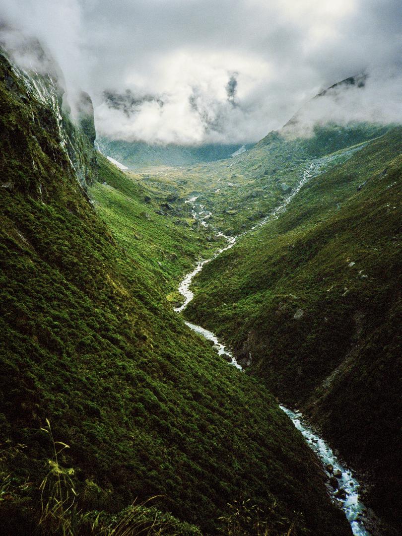 A river below the French ridge [Olympus XA | Zuiko f/2.8 35mm | Portra 400], shot on olympus xa with kodak portra 400