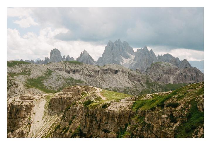 Hike in the Dolomites with a storm approaching in the distance | Nikon F75 Portra 400