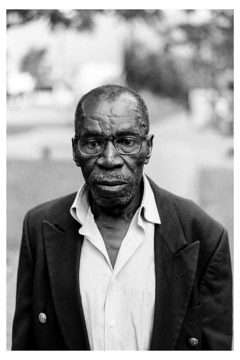First time having the courage to ask a stranger for a portrait and developing myself, although my lab kinda messed up the scanning :(: [Nikon F5, 50mm 1.8G - Foma 100]