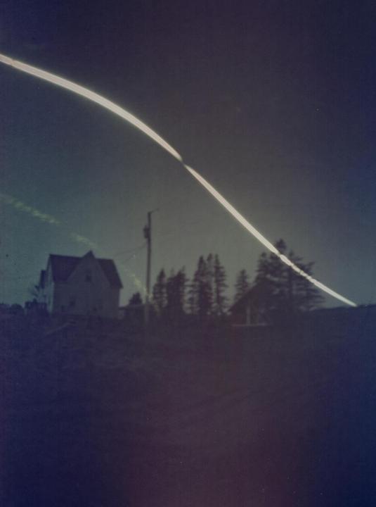 Eclipse in Prince Edward Island, Canada: Solargraph on expired darkroom paper, 24 hour exposure, Mango Mai Tai Can]