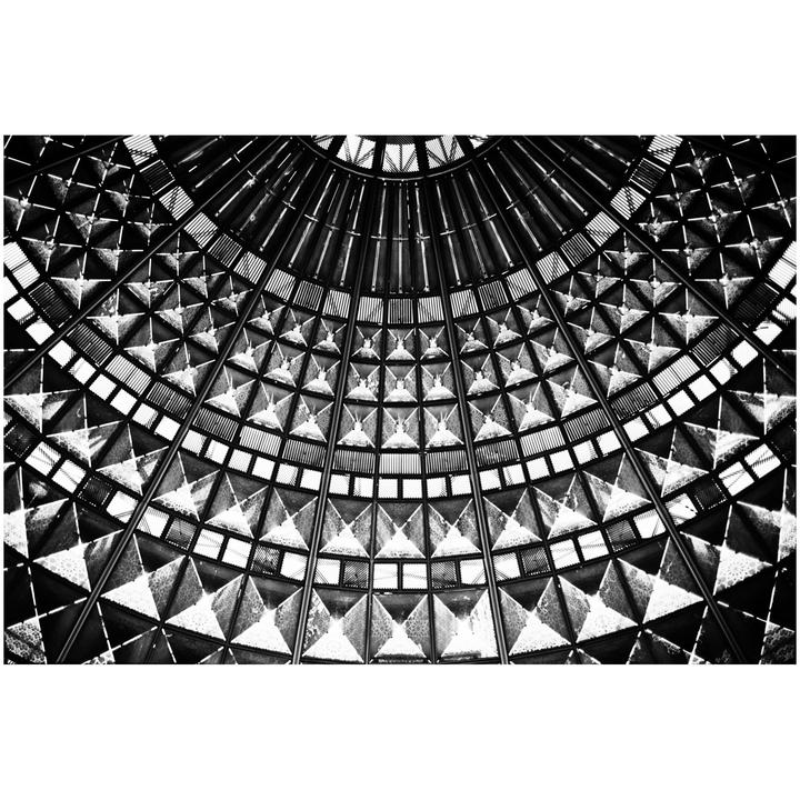 A black and white abstract image shows a geometric pattern of squares and triangles.