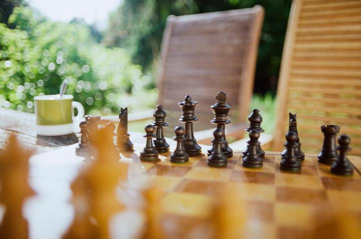 Chess in the garden [Pentax ME Super, 50mm f2.8, Kodak Gold 200]