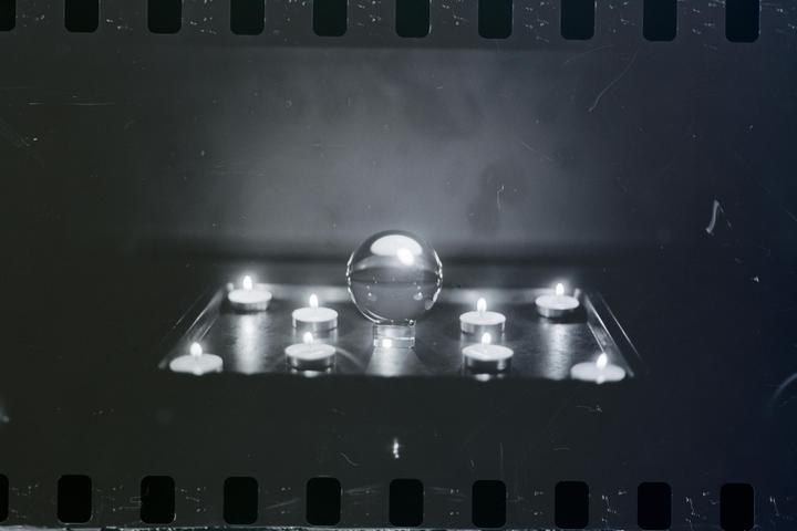 Candles with a ball of Glass - Japan Camera Hunter Street Pan 400 - Canon AE1 - 50mm 720nm filter.