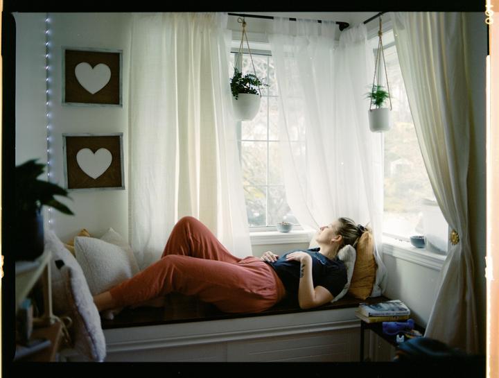 My Fiancée hanging out on our window seat, Mamiya 645 1000s, Portra 400