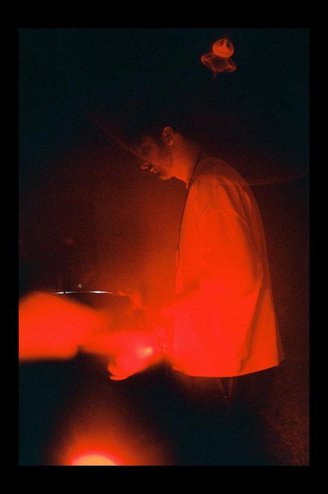 Picture I took at friend DJing came out with the most badass reflection, can someone explain the physical process?