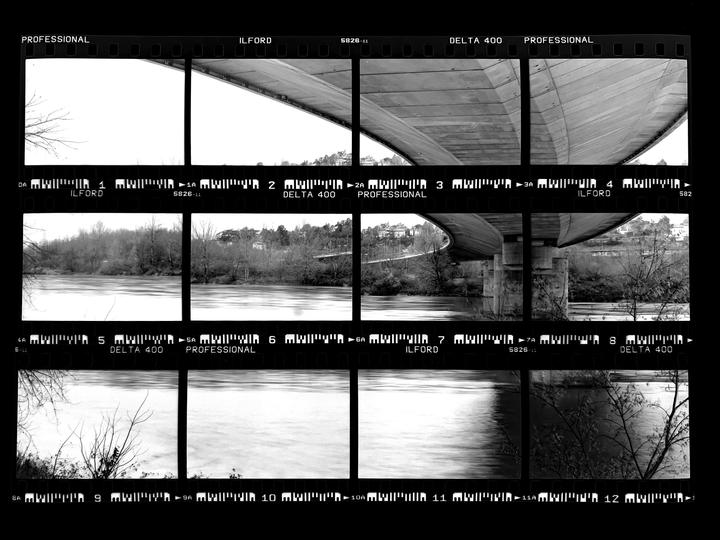 A contact sheet displays multiple black and white photographs of a river and the underside of a bridge.