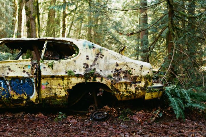 My first time visiting the PNW and I found a car that might need a tire change [Pentax K1000, 50mm f/2.0, Kodak Gold]