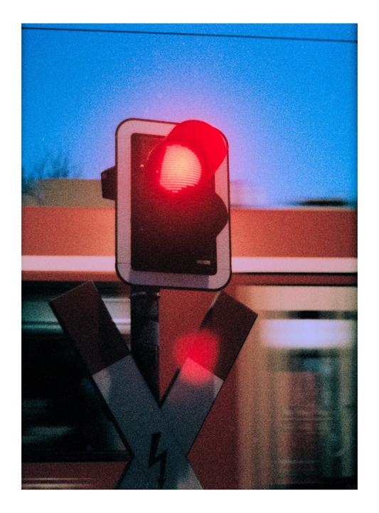Train Crossing at Dusk [Konica Auto-Reflex (Half-Frame), Hexanon 50mm f/1.4, ORWO Wolfen NC 500]