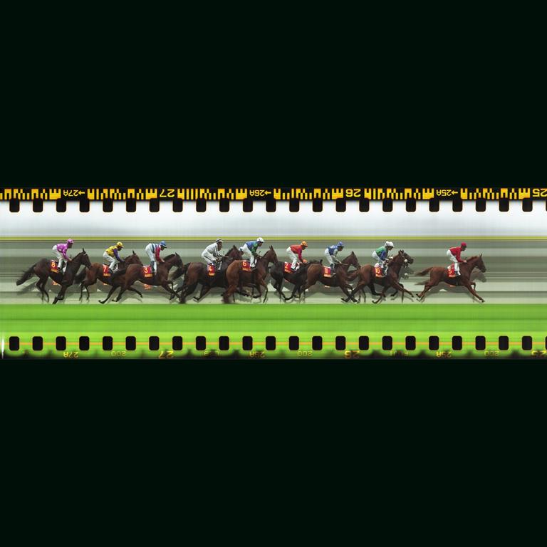 A slit-scan image shows a horse race with multiple horses and jockeys in motion.