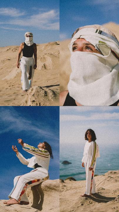 A woman in white clothing and a head covering is shown in four different poses on a sandy landscape with a body of water in the background.