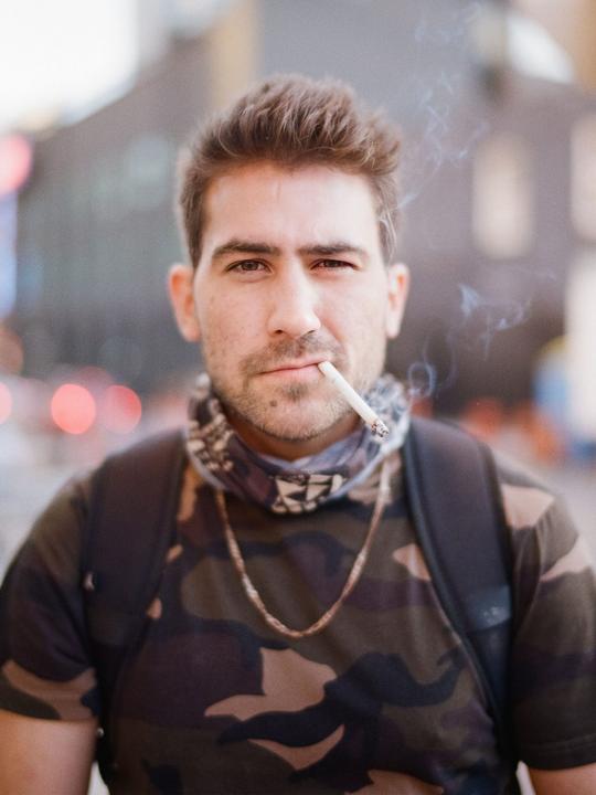 UberEats cyclist street portrait | Voigtlander Bessa R3A, 40mm f1.2 (wide open), ColorPlus 200