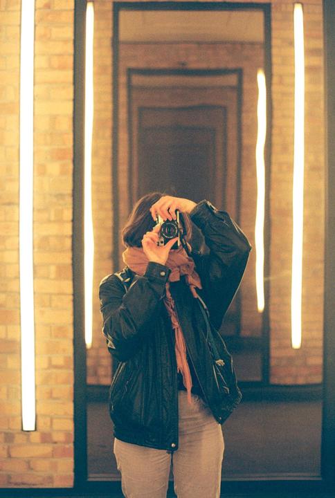 Had to take the classic "I just started film photography" mirror selfie [Canon AE-1, Kodak Ultramax 400]